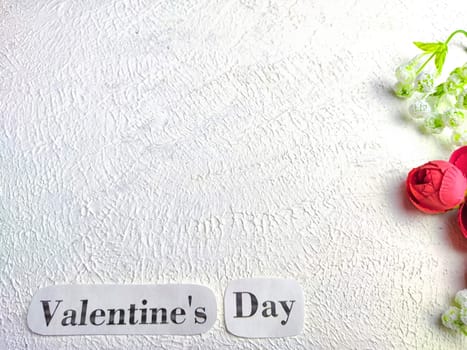 White background, flowers and Valentine's Day inscription. Concept of holiday. Card, Background, Texture, Frame, copy space, place for text