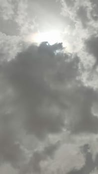 gray sky, clouds white sun, nature weather air background. High quality photo