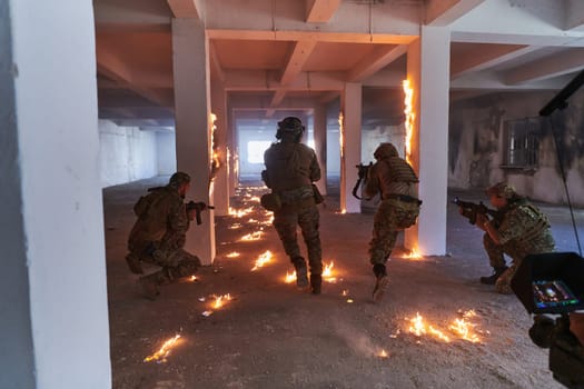 A professional cameraman captures the intense moments as a group of skilled soldiers embarks on a dangerous mission inside an abandoned building, their actions filled with suspense and bravery.