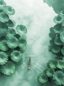 A boat is floating on a river with green lily pads on the shore. The boat is surrounded by trees and the water is calm