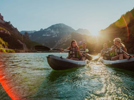 A group of friends enjoying fun and kayaking exploring the calm river, surrounding forest and large natural river canyons during an idyllic sunset