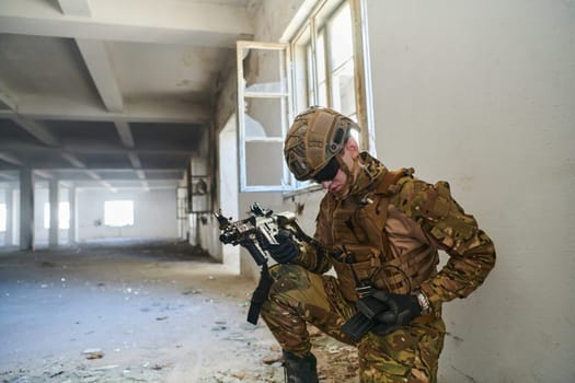 soldier in action near window changing magazine and take cover.