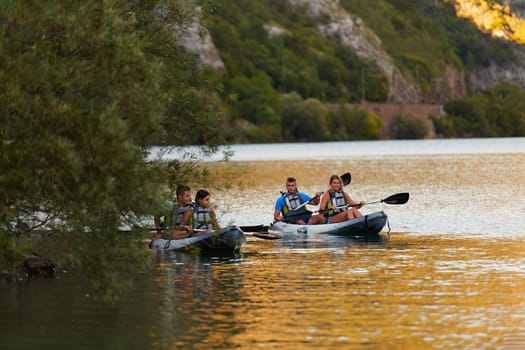 A group of friends enjoying having fun and kayaking while exploring the calm river, surrounding forest and large natural river canyons.