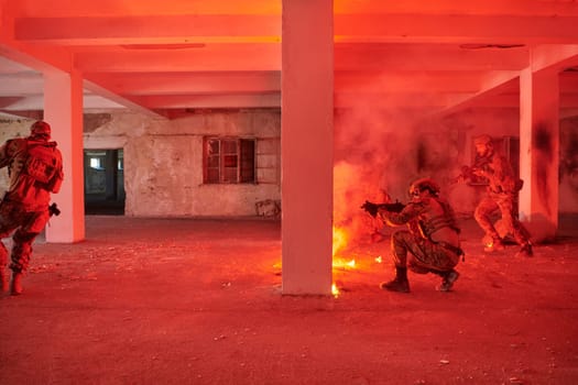 A group of professional soldiers bravely executes a dangerous rescue mission, surrounded by fire in a perilous building