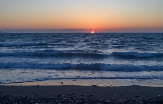 Calm sea with sunset sky and sun through the clouds. 3