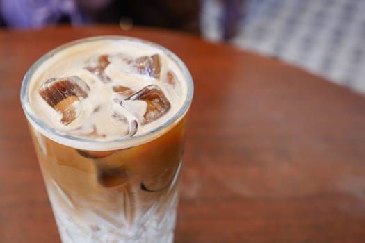 iced late in a transparent glass on cafe table ,