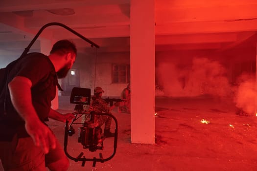 A professional cameraman captures the intense moments as a group of skilled soldiers embarks on a dangerous mission inside an abandoned building, their actions filled with suspense and bravery.