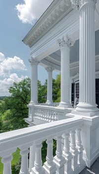 A building with a white porch featuring columns, balusters, and a railing under a sunny sky, blending urban design with composite material