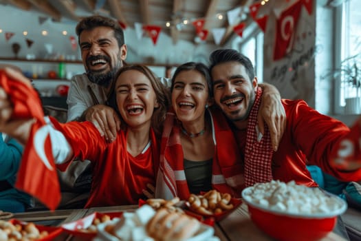 Sports fans cheering during a match at home.