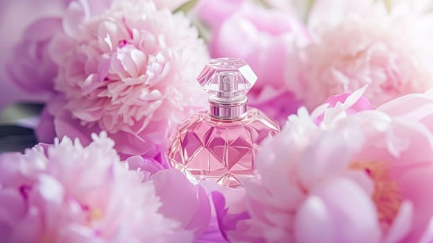 Perfume bottle with beautiful flowers. Floral background. Beauty concept. Flat lay, top view.