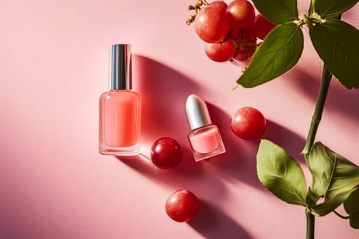 A bottle of nail polish sits on a table next to a bottle of nail polish remover and a bottle of nail polish. There are also a few red grapes and a leafy green plant in the background