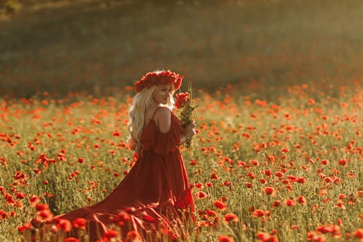 A woman in a red dress is standing in a field of red flowers. She is holding a bouquet of red flowers in her hand