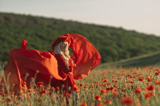 A woman in a red dress is standing in a field of red flowers. The scene is serene and peaceful, with the woman's flowing dress and the vibrant red flowers creating a sense of beauty and tranquility