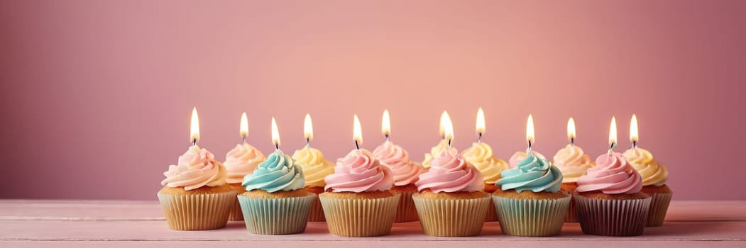 Colorful cupcakes with lit candles are displayed against a pink background, indicating an indoor celebration event marking of joy and celebrating. with free space.