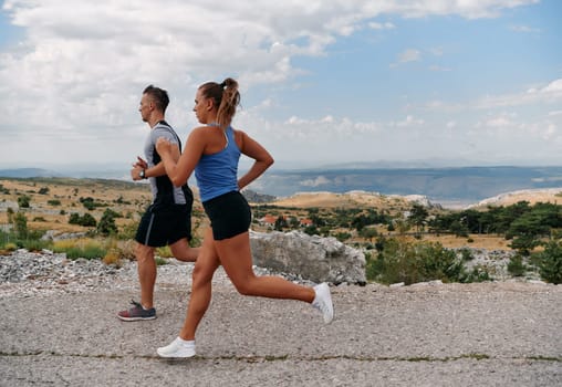 Couple conquer challenging mountain trails during an invigorating morning run.