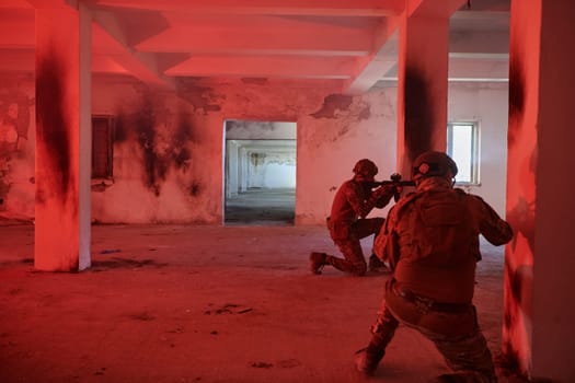 A group of professional soldiers bravely executes a dangerous rescue mission, surrounded by fire in a perilous building