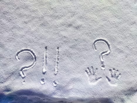 A large question mark is etched into the fresh snow, creating a stark contrast against the white surface on a serene winter morning.