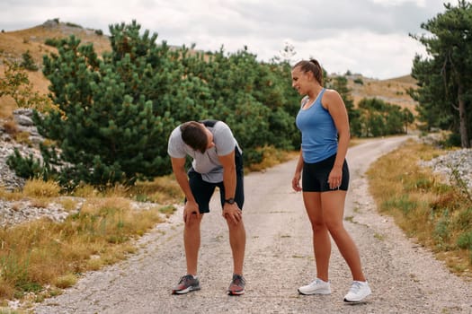 A romantic couple enjoys a serene moment of rest and affection after their morning run, basking in the glow of their shared fitness journey