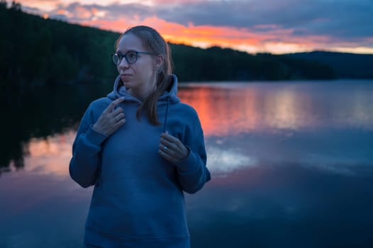 Woman on the pier, closeup portrait, beauty summer sunset