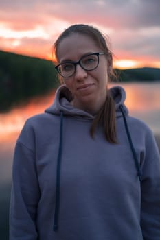 Woman on the pier, closeup portrait, beauty summer sunset