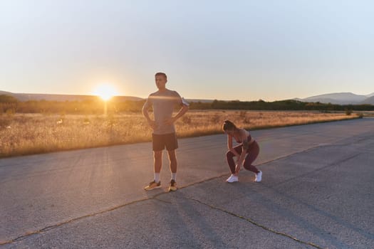 A couple resting after a rigorous morning run, embracing the tranquility of their surroundings as they find rejuvenation, fulfillment, and a deep sense of contentment in each other's company, embodying the essence of balance and well-being in their fitness journey.