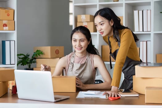 Business Ecommerce success, Female online store owners giving each other a high five in celebration.