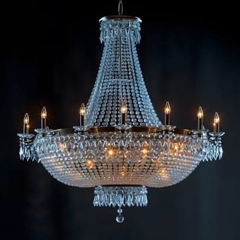 A skyscraperinspired composite material chandelier with symmetrical candles hanging from it. This electric ceiling fixture lights up city events with a liquidlike glow