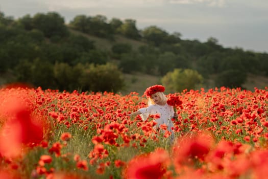 A young girl is standing in a field of red poppies. She is wearing a red headband and is reaching out to a flower. The scene is peaceful and serene, with the girl surrounded by the beauty of nature
