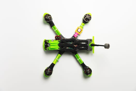 DIY quadcopter on a white background. Modern radio controlled FPV drone.