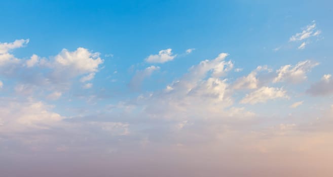 Peaceful and serene sky with clouds on sunset background