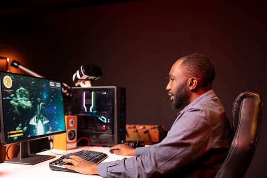 Man at home shooting asteroids in spaceship flying singleplayer game with overlay HUD showing health, fuel, ammo bars and minimap. Gamer navigating universe in simulation game, having fun