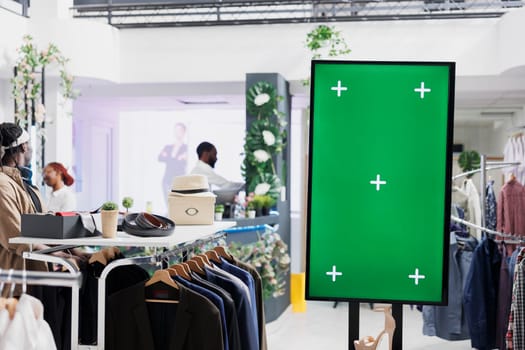 Empty green screen mock up advertising shoes new collection in fashion boutique. Blank chroma key interactive display for promotion and stiletto showcasing for clients in mall