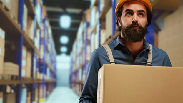 Loader checks orders and loads industrial merchandise into boxes, filling in cargo containers with the specified requirements. Depot staff member preparing outgoing deliveries and shipments.