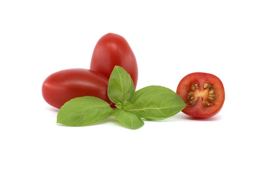 Close-up of fresh Roma tomatoes, including halved ones, alongside basil leaves on a white background. Perfect for illustrating healthy eating and fresh ingredients.