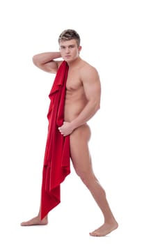 Handsome young man covers his nakedness with red cloth