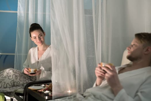 Image of pleased woman posing at camera in spa center