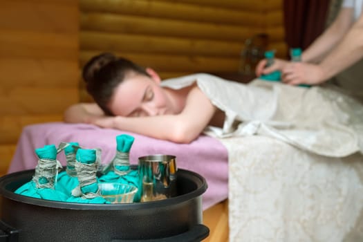 Beauty and health. Traditional thai massage with salt bags