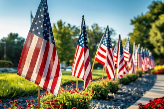 A row of USA flags standing in Remembrance on Memorial Day in the Unit amidst sunlight..