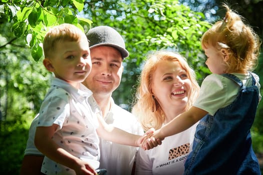 Family playing in the forest