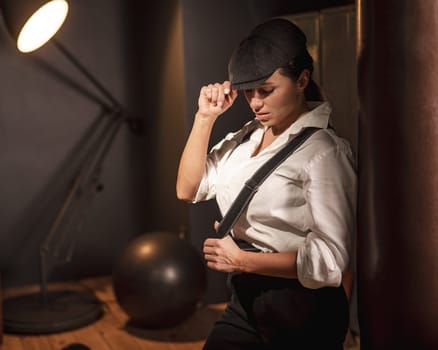 Caucasian woman in a men's suit in the style of Peaky Blinders