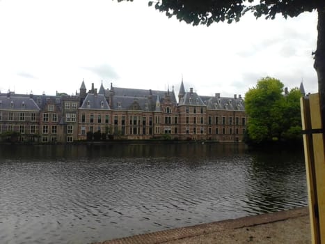 On the opposite bank there are many three-story buildings.