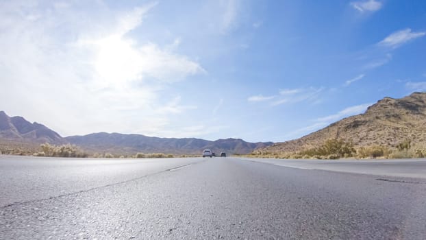 Embarking on a road trip from Nevada to California, driving on Highway 15 during the day offers scenic views and an exciting journey between states.