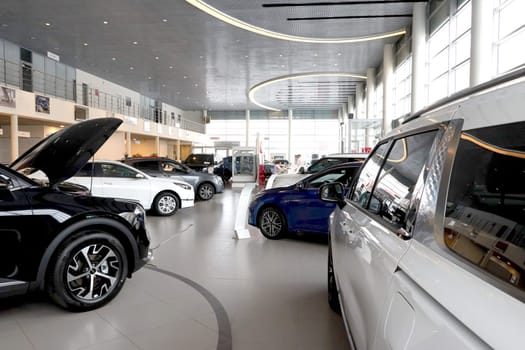 Kazan, Russia - November 25, 2022: Cars in showroom of dealership Kia in Kazan in Russia. Partial focus