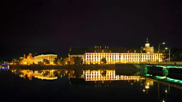 Night panorama over the river with a view of the university and library and bridges in Wroclaw, Poland