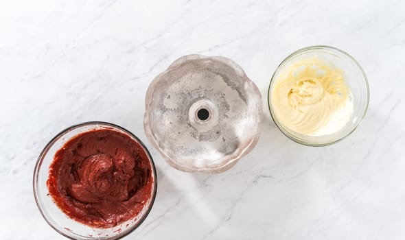 Flat lay. Filling metal bundt cake pan with cake butter to bake red velvet bundt cake with cream cheese glaze