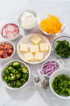 Pressure Cooker Baked Potatoes. Garnishes in small pinch bowls to serve over the baked potatoes.