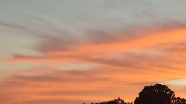 beautiful orange sunset, evening sky clouds nature landscape air, may weather. High quality photo
