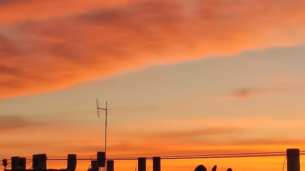 beautiful orange sunset, evening sky clouds nature landscape air, may weather. High quality photo