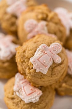 Pile of eggnog cookies with a chocolate gingerbread man in a stack.