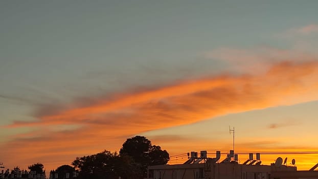beautiful orange sunset, evening sky clouds nature landscape air, may weather. High quality photo